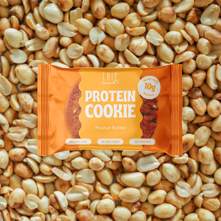 Protein cookie package with peanut butter flavor on a background of peanuts