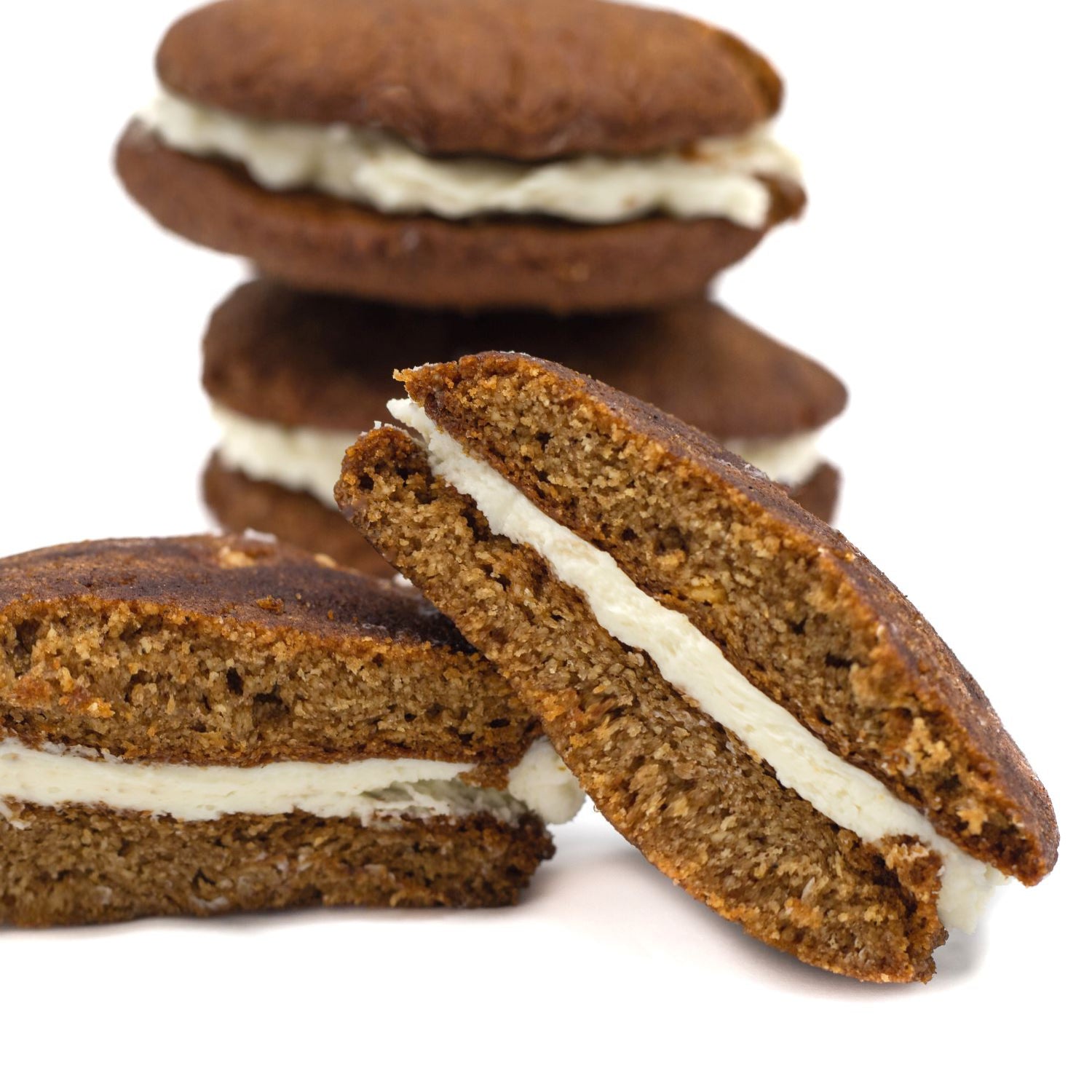 Pumpkin Spice keto cookie sandwich cut open to show the creamy filling
